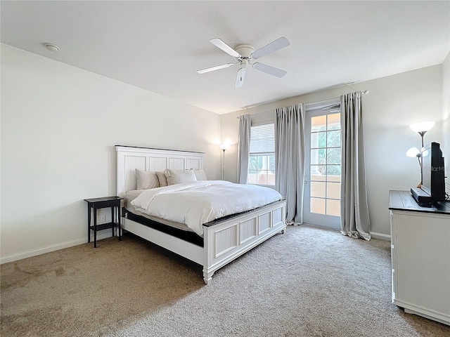 bedroom with ceiling fan and light carpet