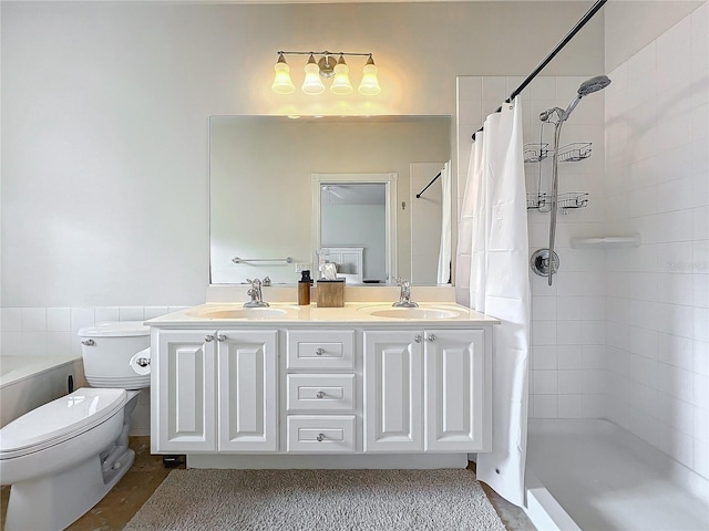 bathroom with vanity, curtained shower, and toilet