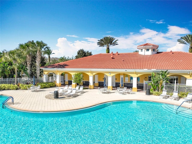 view of swimming pool featuring a patio area