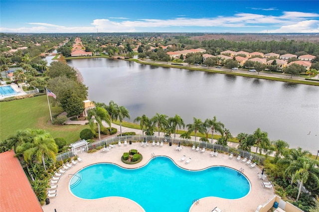 view of swimming pool with a water view