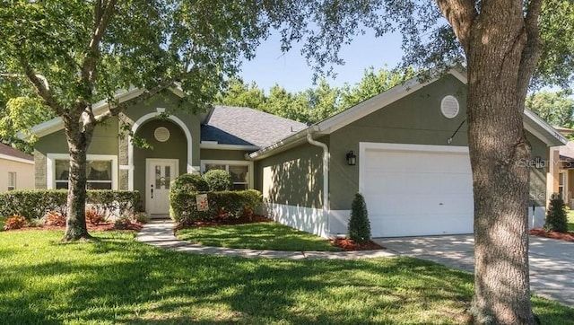 ranch-style home featuring a front lawn and a garage