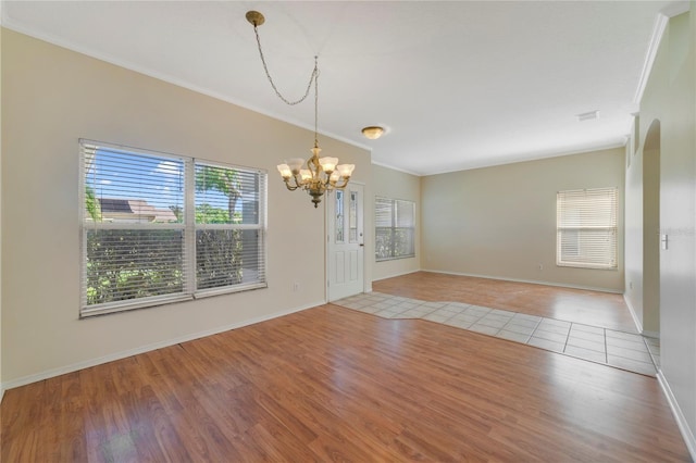 2961 Cedar Glen Pl, Oviedo, FL 32765 - interior space featuring a chandelier, light wood finished floors, and ornamental molding