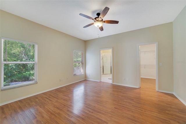 2961 Cedar Glen Pl, Oviedo, FL 32765 - unfurnished room featuring light wood-style flooring, ceiling fan, and baseboards