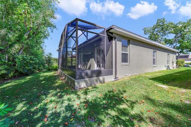 2961 Cedar Glen Pl, Oviedo, FL 32765 - view of property exterior featuring stucco siding, a lanai, and a lawn