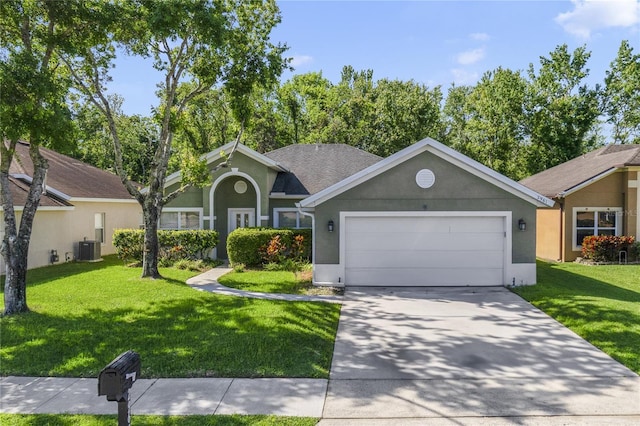 2961 Cedar Glen Pl, Oviedo, FL 32765 - ranch-style house with a garage, central air condition unit, stucco siding, and driveway