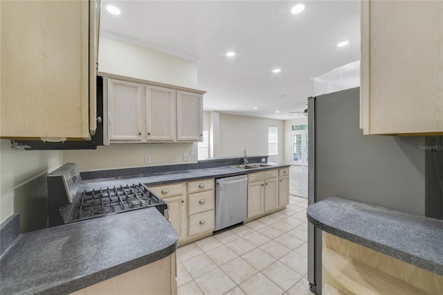 2961 Cedar Glen Pl, Oviedo, FL 32765 - kitchen with light brown cabinets, a ceiling fan, dark countertops, stainless steel appliances, and a sink