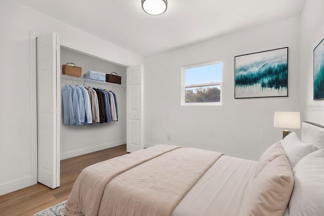 bedroom featuring hardwood / wood-style flooring and a closet