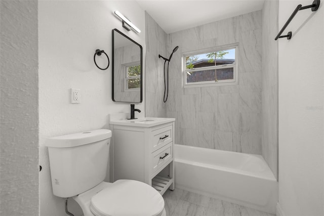 full bathroom with vanity, toilet, and tiled shower / bath