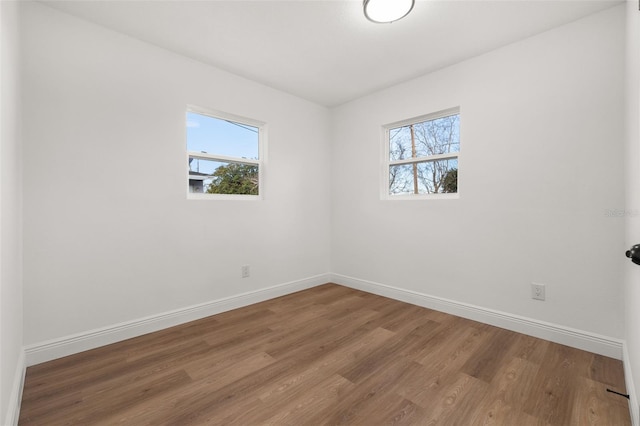 empty room featuring wood-type flooring