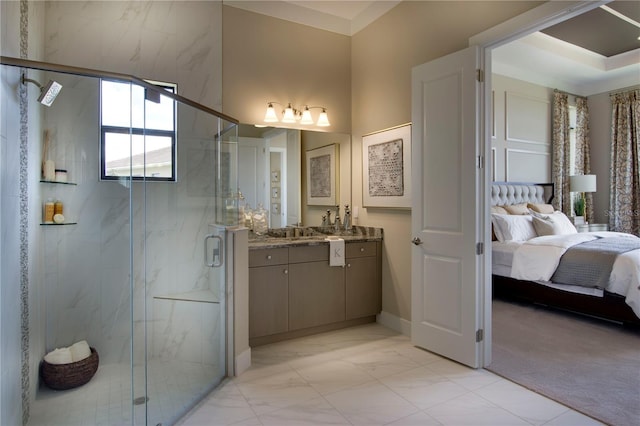 bathroom with vanity and a shower with shower door