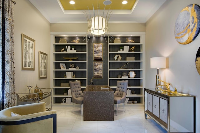 living area featuring a raised ceiling, built in features, and crown molding