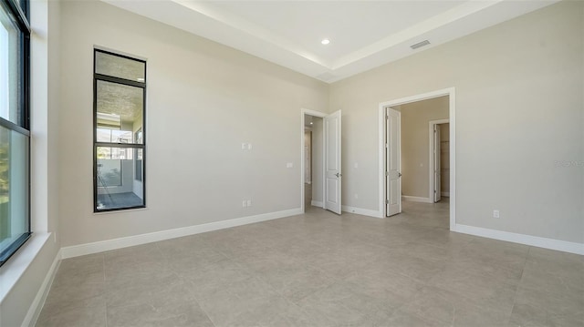 spare room featuring visible vents, baseboards, and recessed lighting