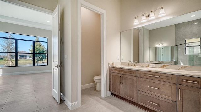 full bathroom with tile patterned flooring, toilet, baseboards, and vanity