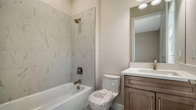 full bathroom featuring toilet, tub / shower combination, and vanity