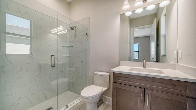 full bath with toilet, vanity, and a stall shower