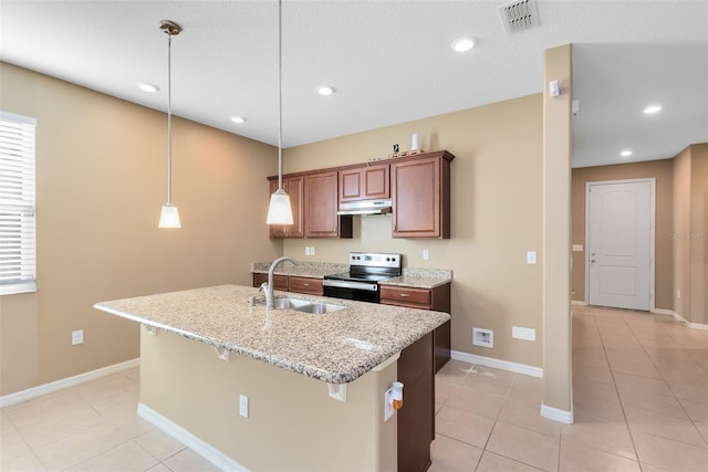 kitchen with pendant lighting, stainless steel electric stove, sink, light stone countertops, and light tile patterned floors