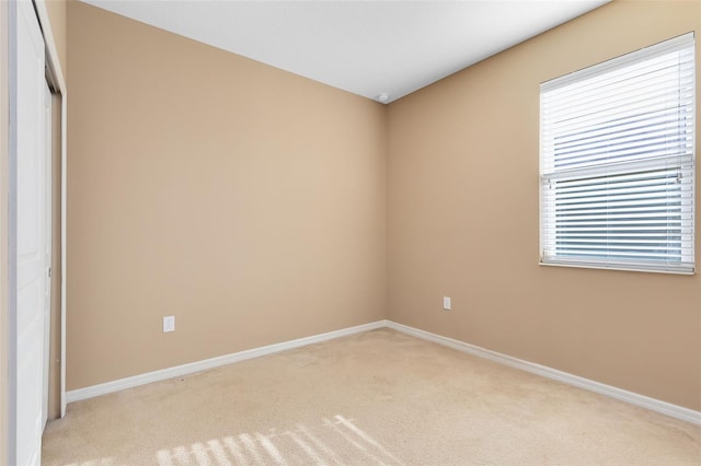 spare room with light carpet