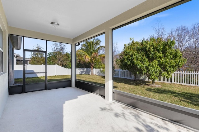 unfurnished sunroom featuring plenty of natural light