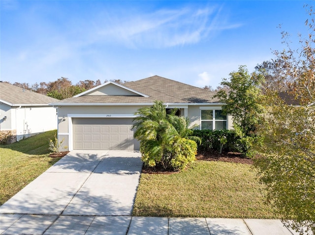 view of front of house featuring a garage and a front yard