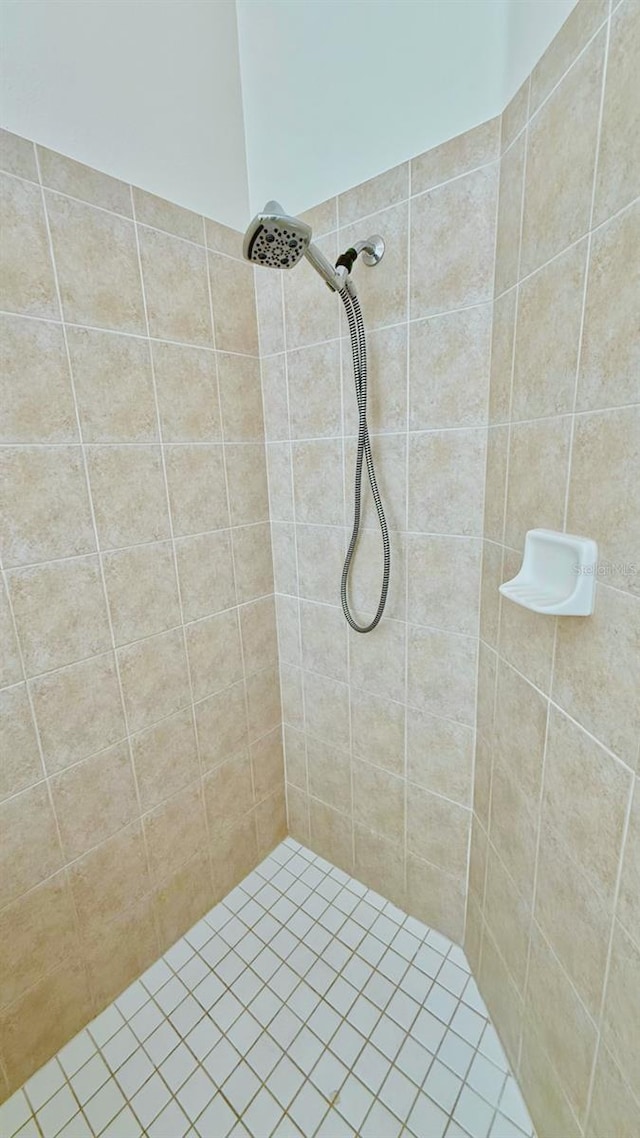 bathroom with a tile shower