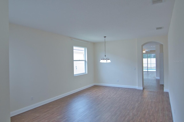 unfurnished room with hardwood / wood-style floors and ceiling fan