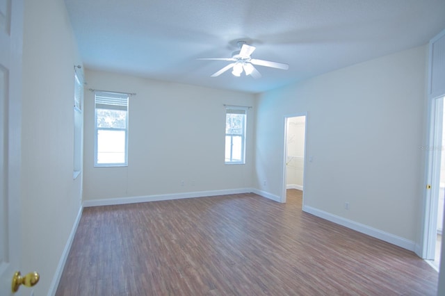 spare room with hardwood / wood-style flooring and ceiling fan