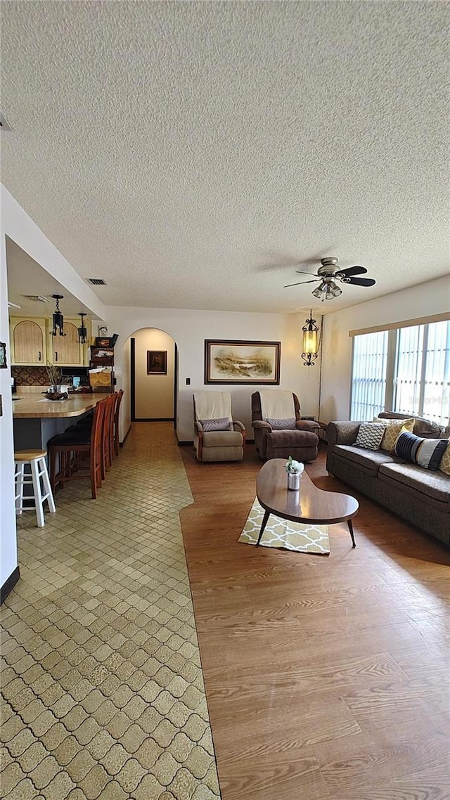 living room featuring ceiling fan