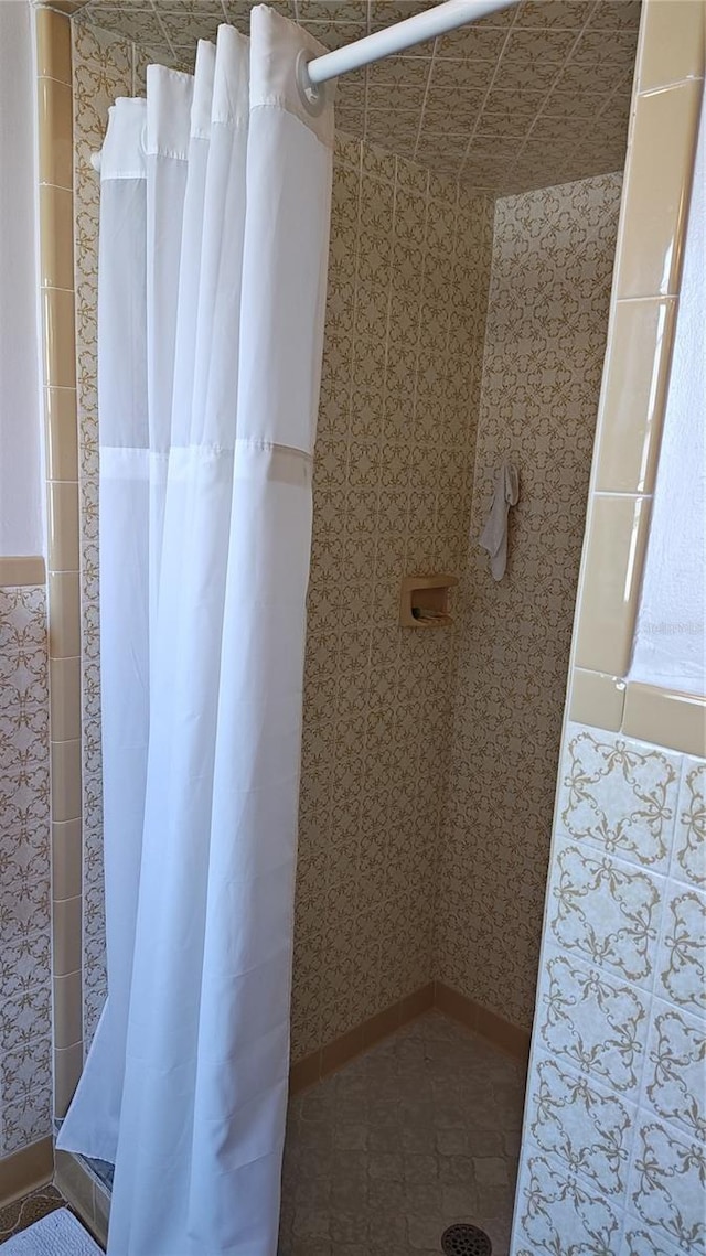 bathroom with a shower with curtain