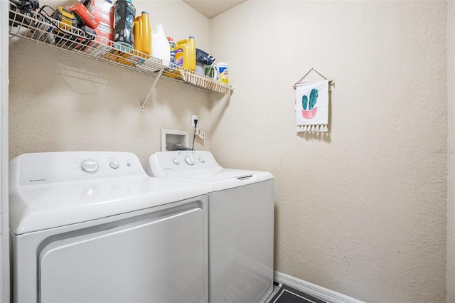 laundry area with washing machine and clothes dryer