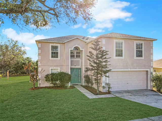 view of front facade featuring a front yard and a garage