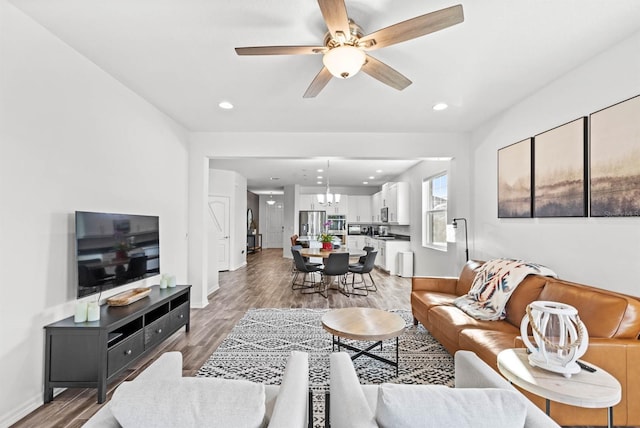 living room with hardwood / wood-style flooring and ceiling fan