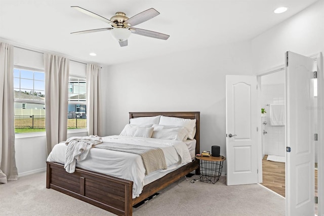 bedroom featuring light colored carpet and ceiling fan