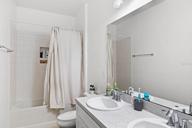 full bathroom with vanity, toilet, and shower / bath combo with shower curtain