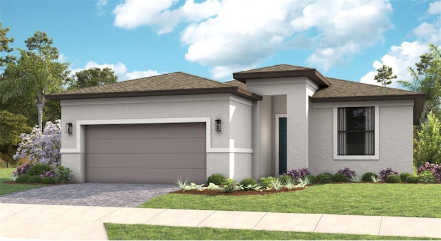 view of front of home featuring a front yard and a garage