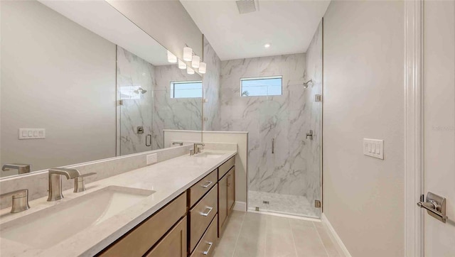 14370 Hammock Oak St, Parrish, FL 34219 - full bathroom with a marble finish shower, double vanity, baseboards, and tile patterned floors