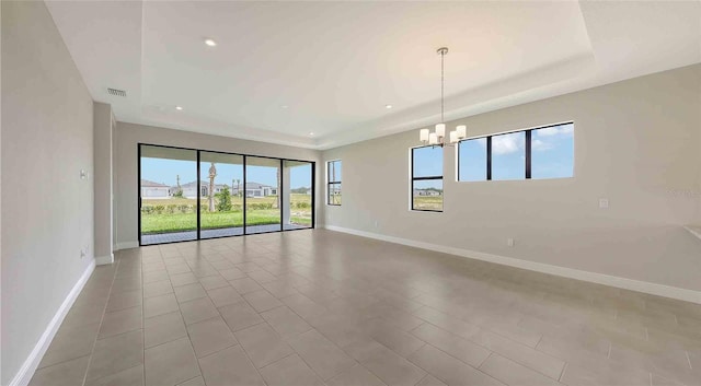 14370 Hammock Oak St, Parrish, FL 34219 - spare room with a chandelier, baseboards, and recessed lighting