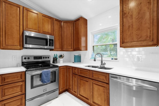 kitchen featuring lofted ceiling, sink, appliances with stainless steel finishes, and tasteful backsplash