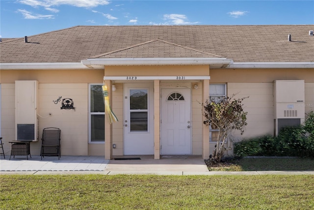 entrance to property with a yard