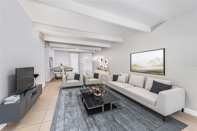 tiled living room featuring beamed ceiling