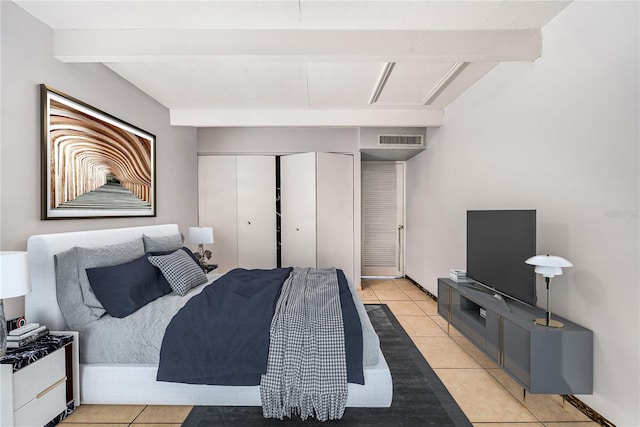 bedroom featuring light tile patterned floors