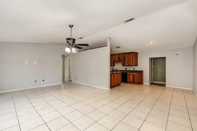 unfurnished living room with ceiling fan, light tile patterned floors, and sink