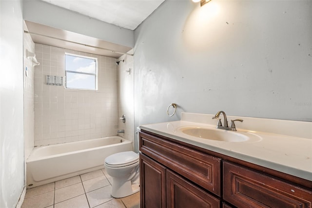 full bathroom featuring tile patterned flooring, vanity, toilet, and tiled shower / bath