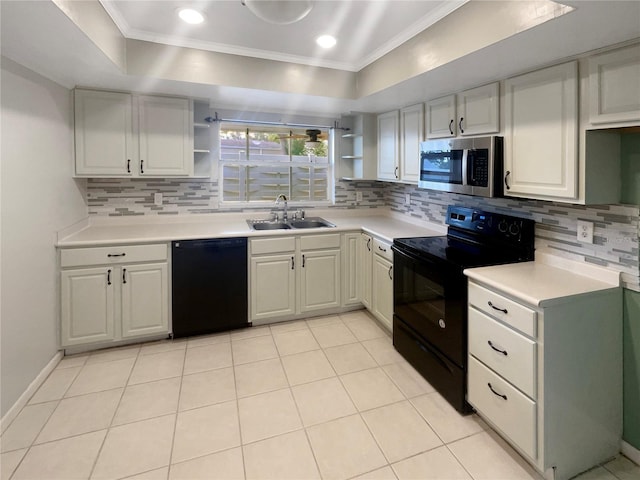 kitchen with black appliances, crown molding, white cabinets, and sink