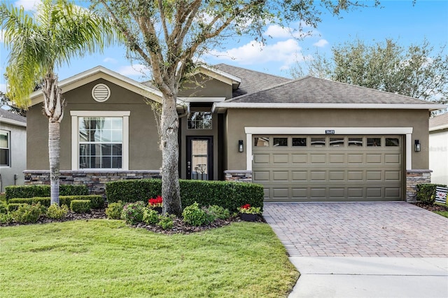 ranch-style house with a front yard and a garage