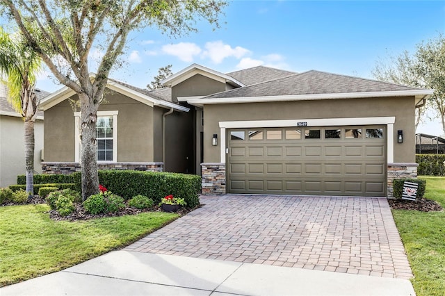 view of front of home with a garage and a front yard