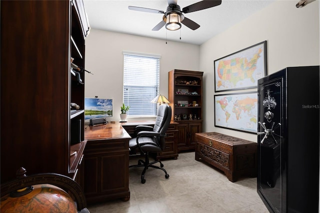 tiled office space featuring ceiling fan