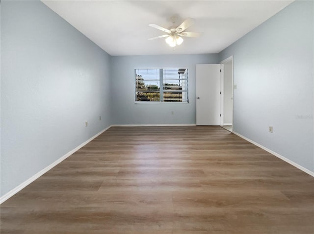 unfurnished room featuring hardwood / wood-style floors and ceiling fan