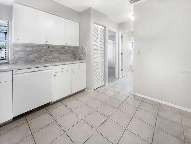 kitchen with backsplash, white cabinetry, dishwasher, and light tile patterned floors