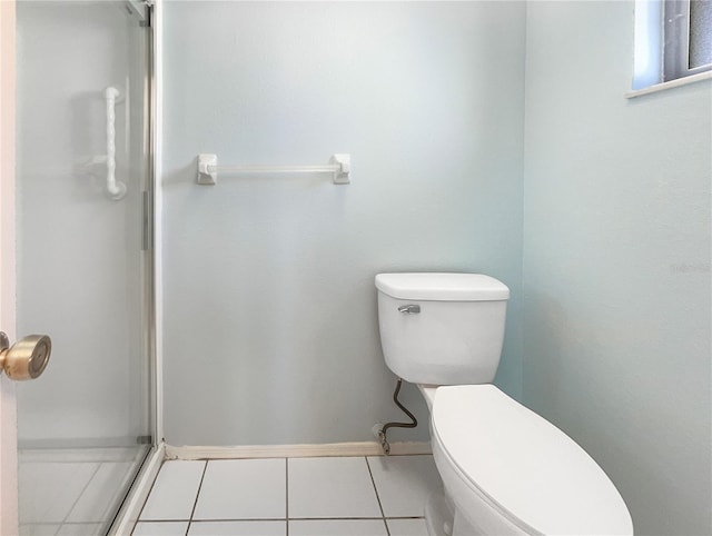 bathroom with tile patterned flooring and toilet