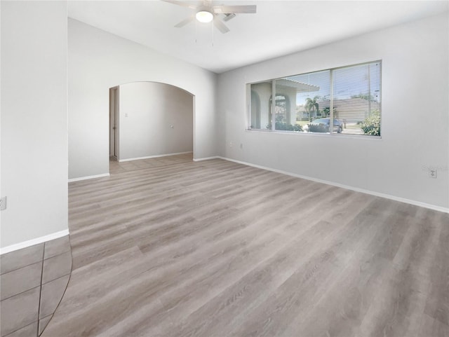 unfurnished room featuring light hardwood / wood-style flooring and ceiling fan